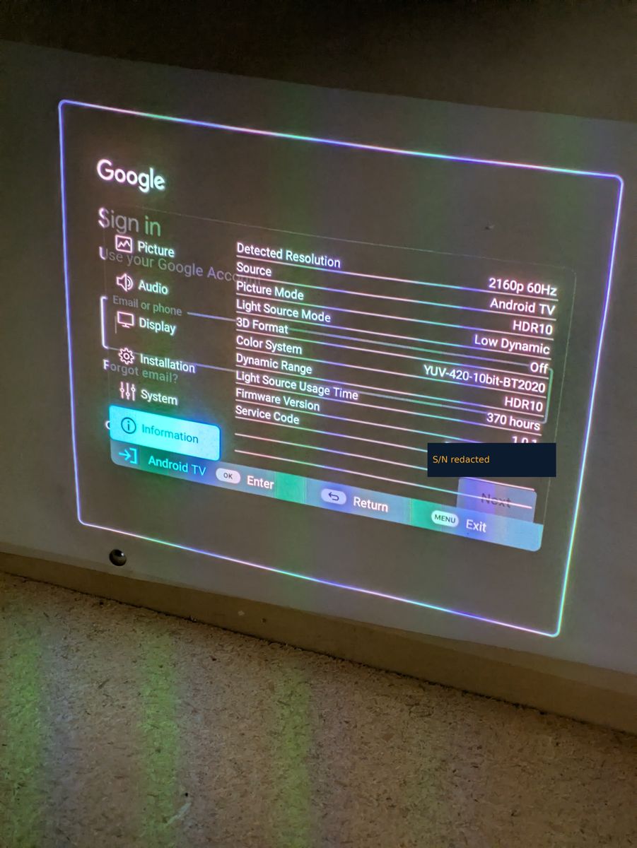 On-screen information menu showing 370 light-source hours and firmware 1.0.1, serial redacted