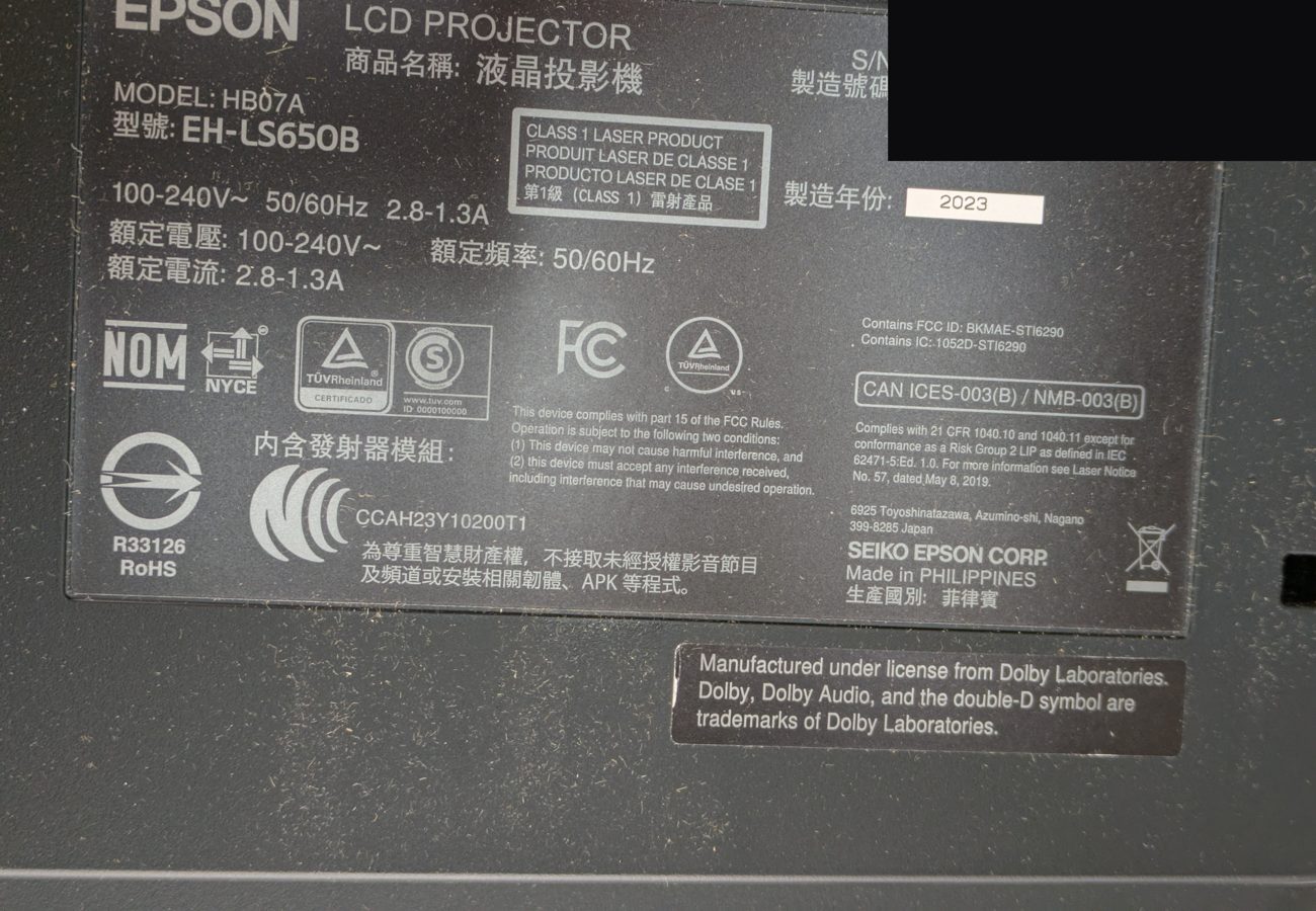Epson label confirming model EH-LS650B, Class 1 laser product, built 2023, serial redacted